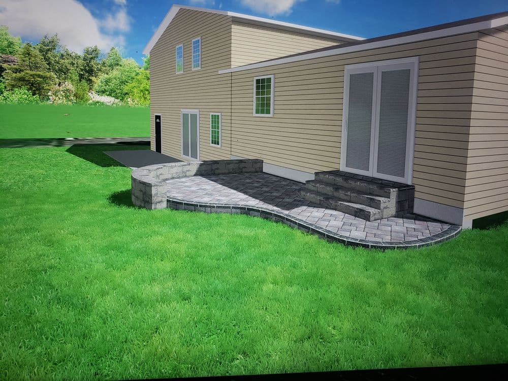Modern home exterior with landscaped garden and paved patio area, featuring curved stone steps.