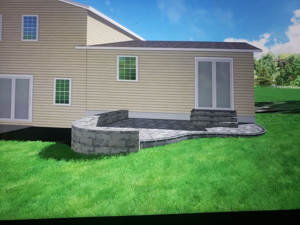 Home exterior with landscaped stone patio and steps, green lawn, and modern design.