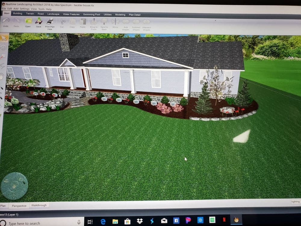 3D landscape design showcasing a home with garden beds and lush green lawn.