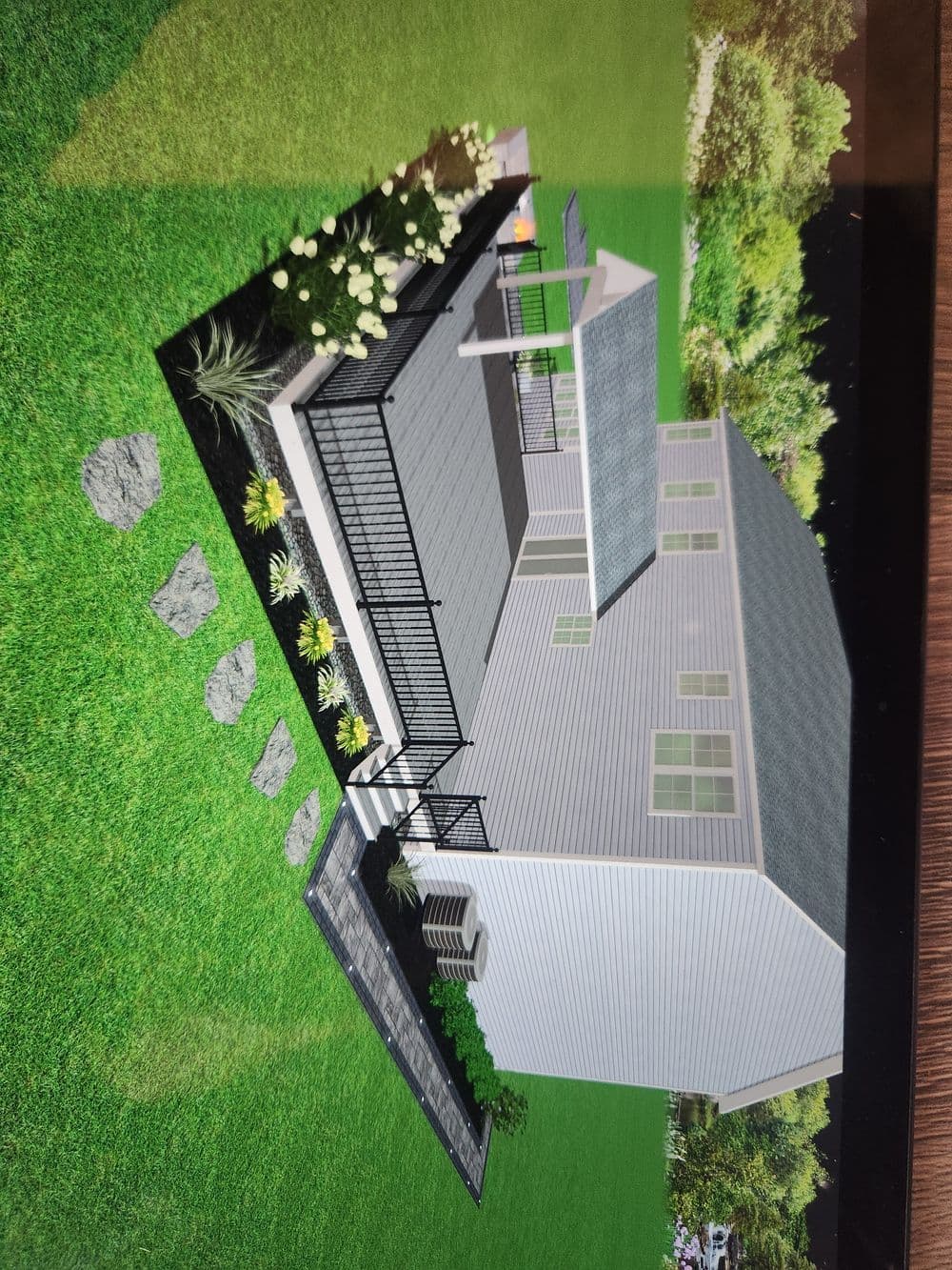 3D rendering of a modern house with landscaped yard featuring a patio and pathway.