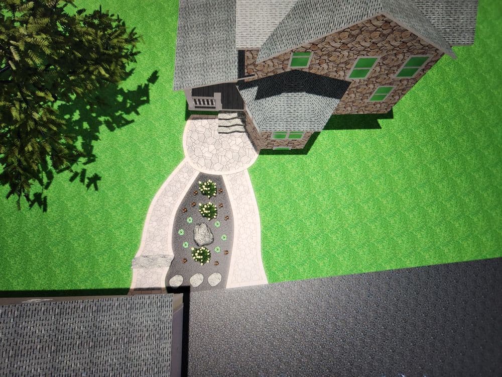 Aerial view of a stone house with a landscaped garden and pathway.