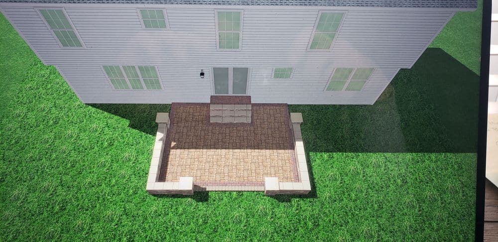 3D rendering of a house with a paved patio and landscaped grass area.