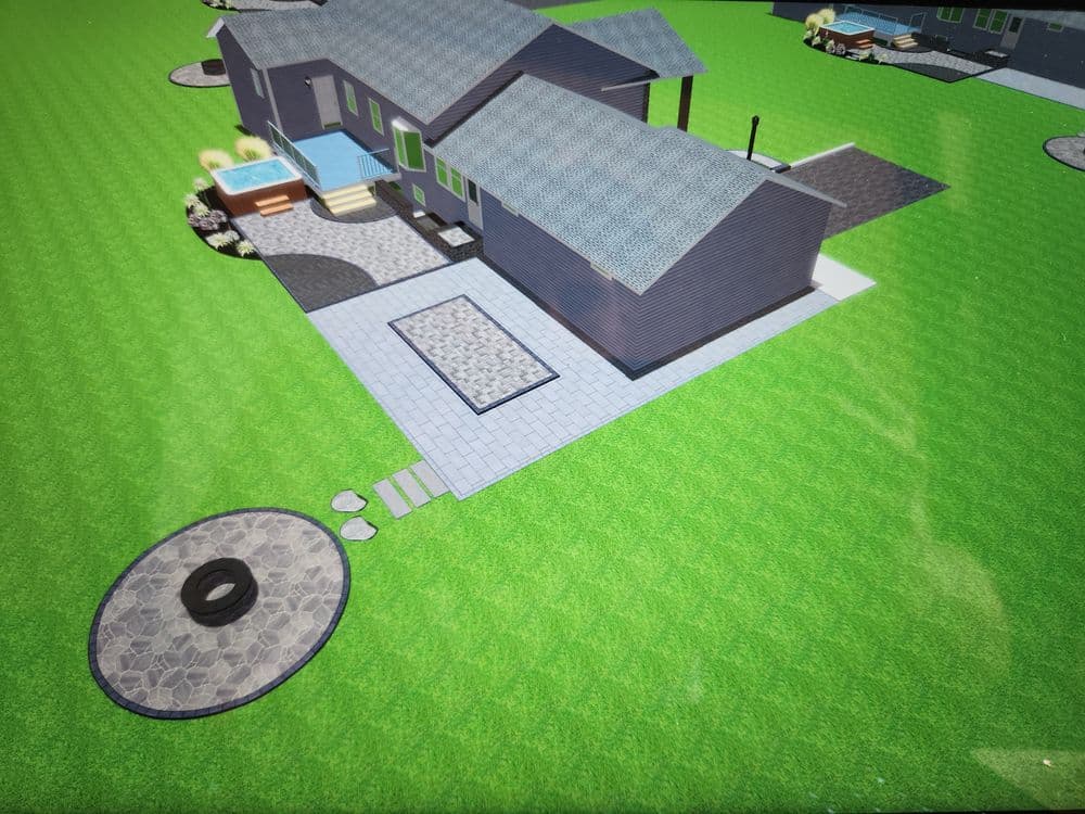 Aerial view of a modern home with a patio, pool, and landscaped yard in a suburban setting.